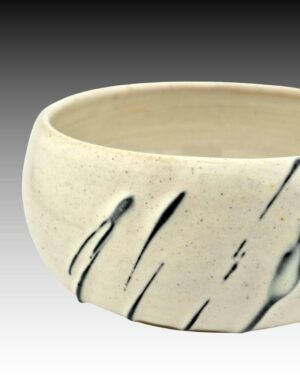wheel thrown mini bowl with black slip trailing and white glaze