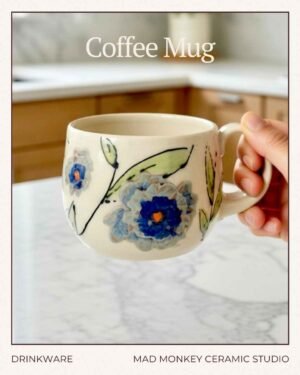 hand painted ceramic mug with leaves and textured flowers